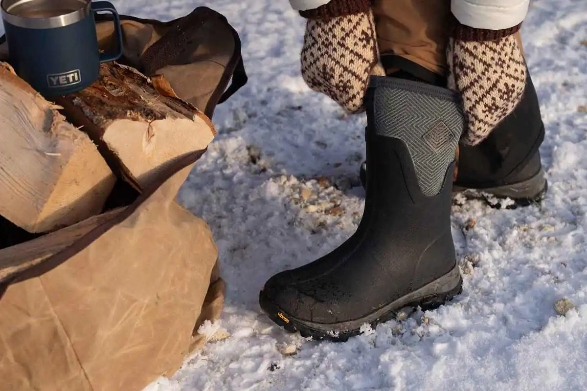 Person wearing wellies in the snow and ice